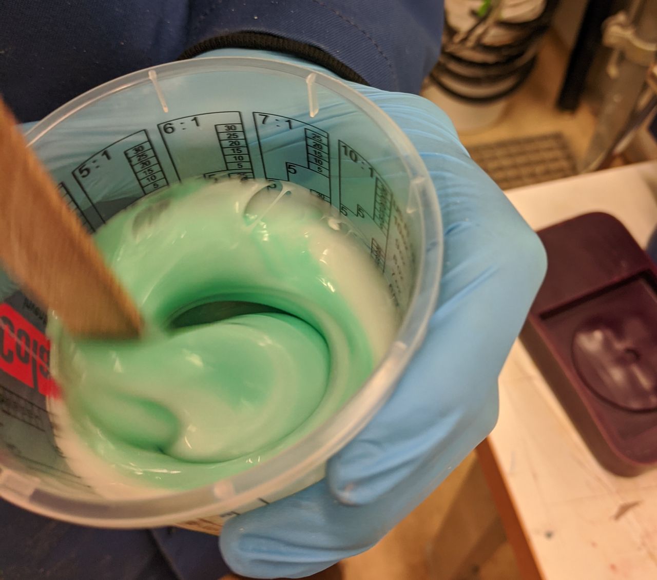 Mixing the two parts of silicone together.